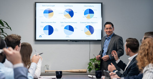 Foresight employees meeting about valuations in conference room