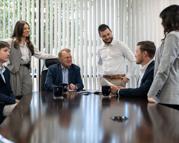 Foresight Employees meeting in conference room for financing